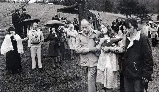A widow grieved at the funeral of her husband, one of 26 miners and rescue workers killed in two explosions at the Scotia Mine in March 1976 in Letcher County. The tragedy reinforced need for the 1977 Mine Safety and Health Act.