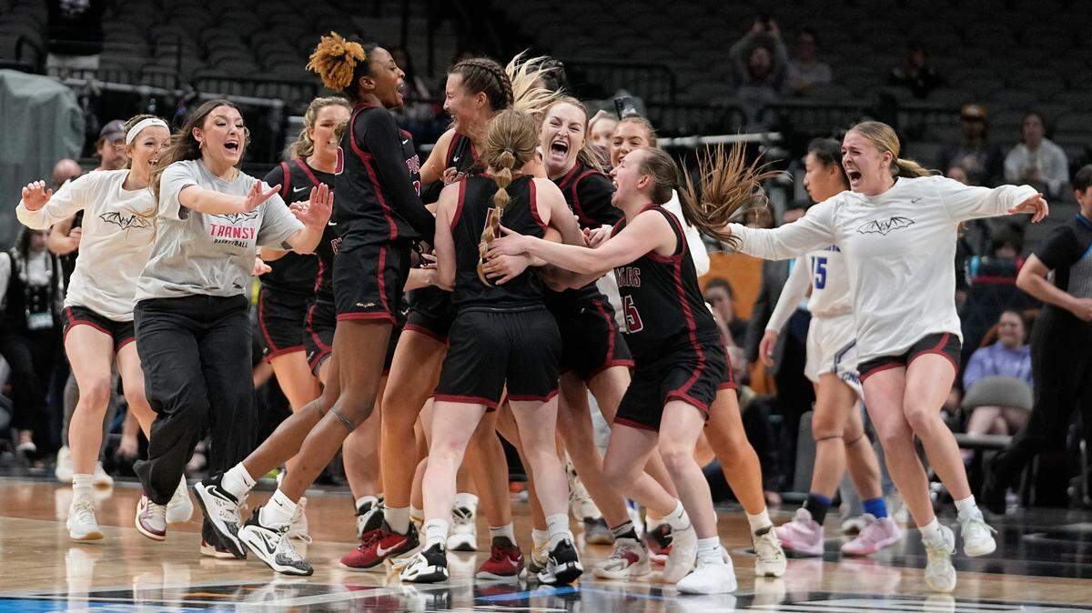Transylvania players celebrate after winning the NCAA Division III championship basketball game against Christopher Newport in Dallas on April 1.