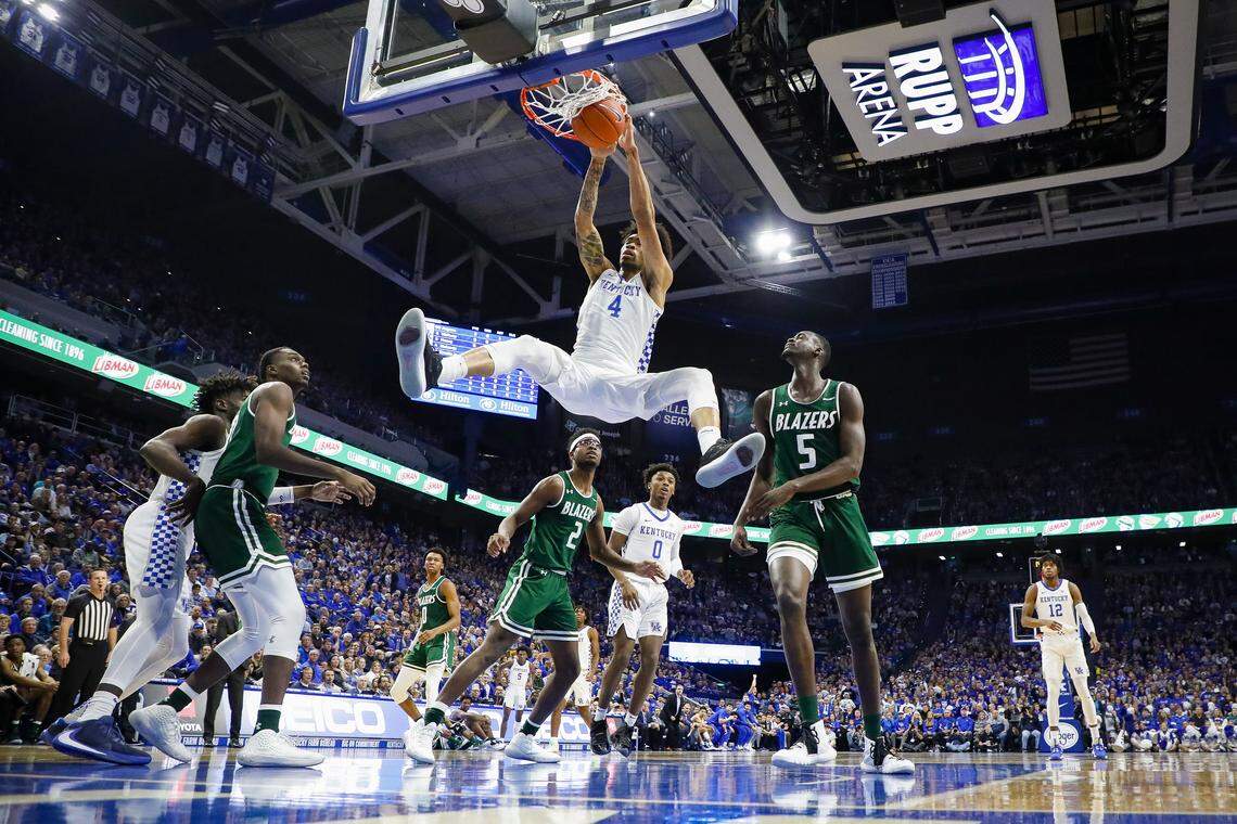 Kentucky Wildcats forward Nick Richards (4) slam dunks the ball over UAB Blazers forward Tamell Pearson (2) and UAB Blazers forward Makhtar Gueye (5) during their game at Rupp Arena in Lexington, Ky., Friday, Nov. 29, 2019.