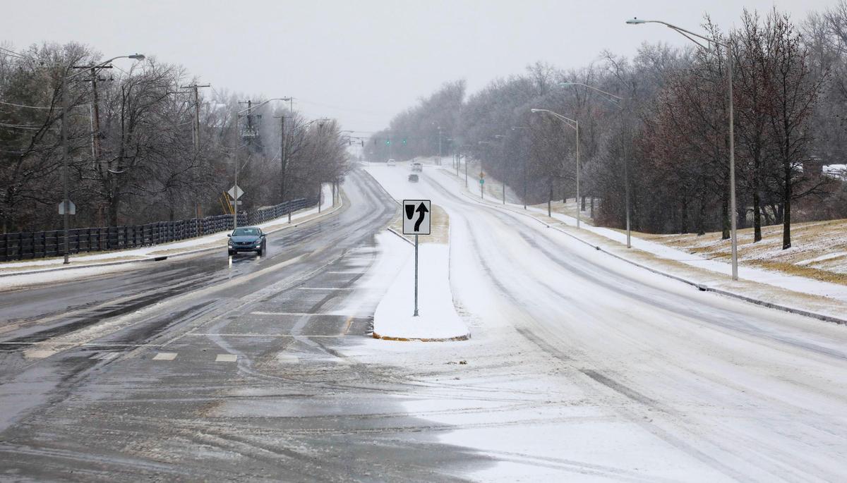 One side of Man o’War Boulevard at Rapid Run Drive was covered with snow and ice while the other lanes of Man o’ War were more clear for drivers Friday morning, Feb. 4, 2022 after an overnight winter storm of ice, sleet and snow blanketed Lexington, Ky.