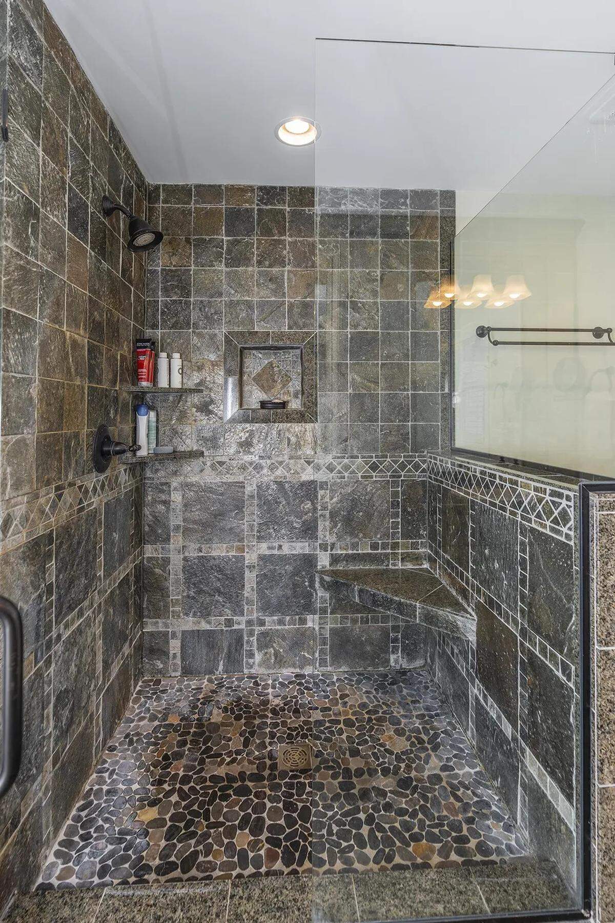 The shower in the primary bedroom’s bathroom at 403 Queensway Drive.