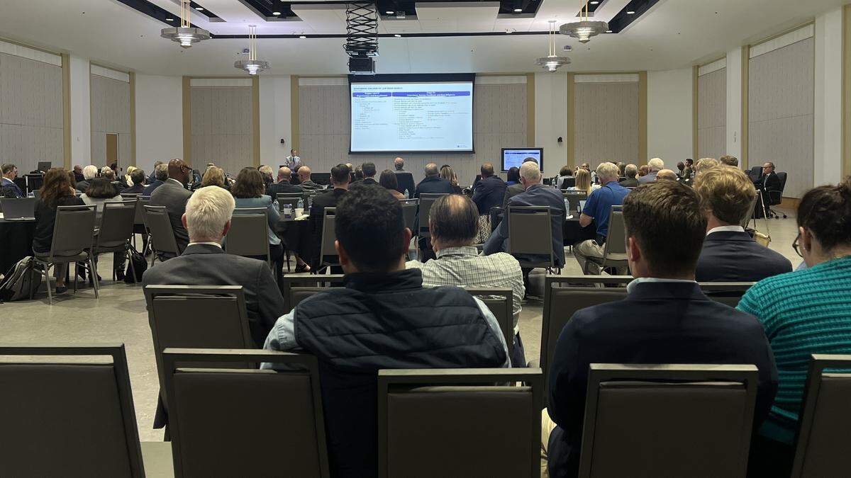 A full room of University of Kentucky Board of Trustees and faculty watch Provost Robert DiPaola’s 45-minute presentation on why federal judge Gregory Van Tatenhove was chosen as the College of Law dean, on Thursday, April 23, 2026.