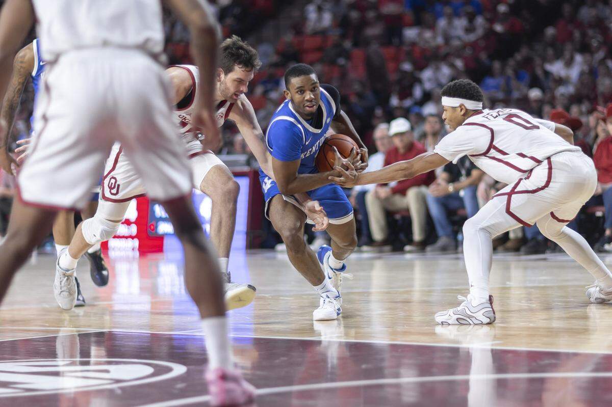 Kentucky guard Lamont Butler (1) drives the ball as Oklahoma guard Jeremiah Fears (0) defends during Wednesday’s game at Lloyd Noble Center in Norman, Okla.