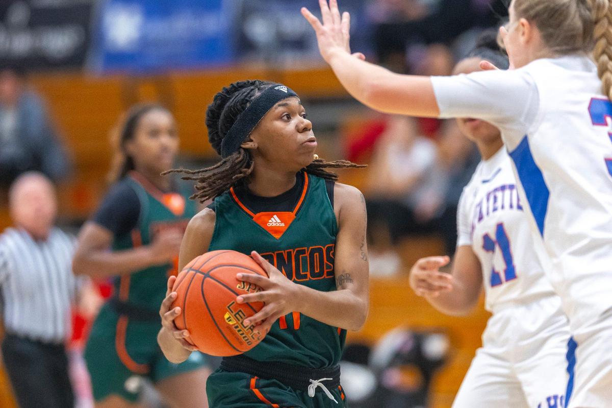 Frederick Douglass’ Mikalee Bennett (11) looks for an opening against Lafayette at Lafayette High School on Wednesday.