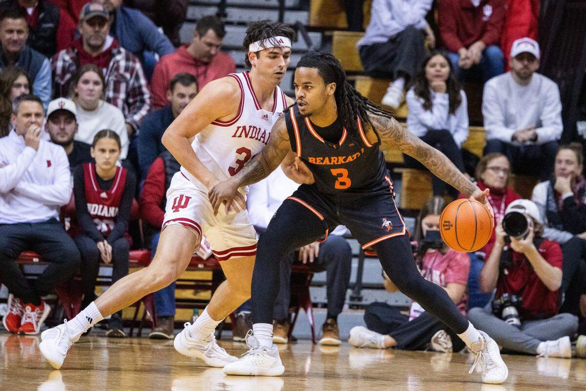 Dec 3, 2024; Bloomington, Indiana, USA; Sam Houston State Bearkats guard Lamar Wilkerson (3) dribbles the ball while Indiana Hoosiers guard Trey Galloway (32) defends in the first half at Simon Skjodt Assembly Hall. Mandatory Credit: Trevor Ruszkowski-Imagn Images