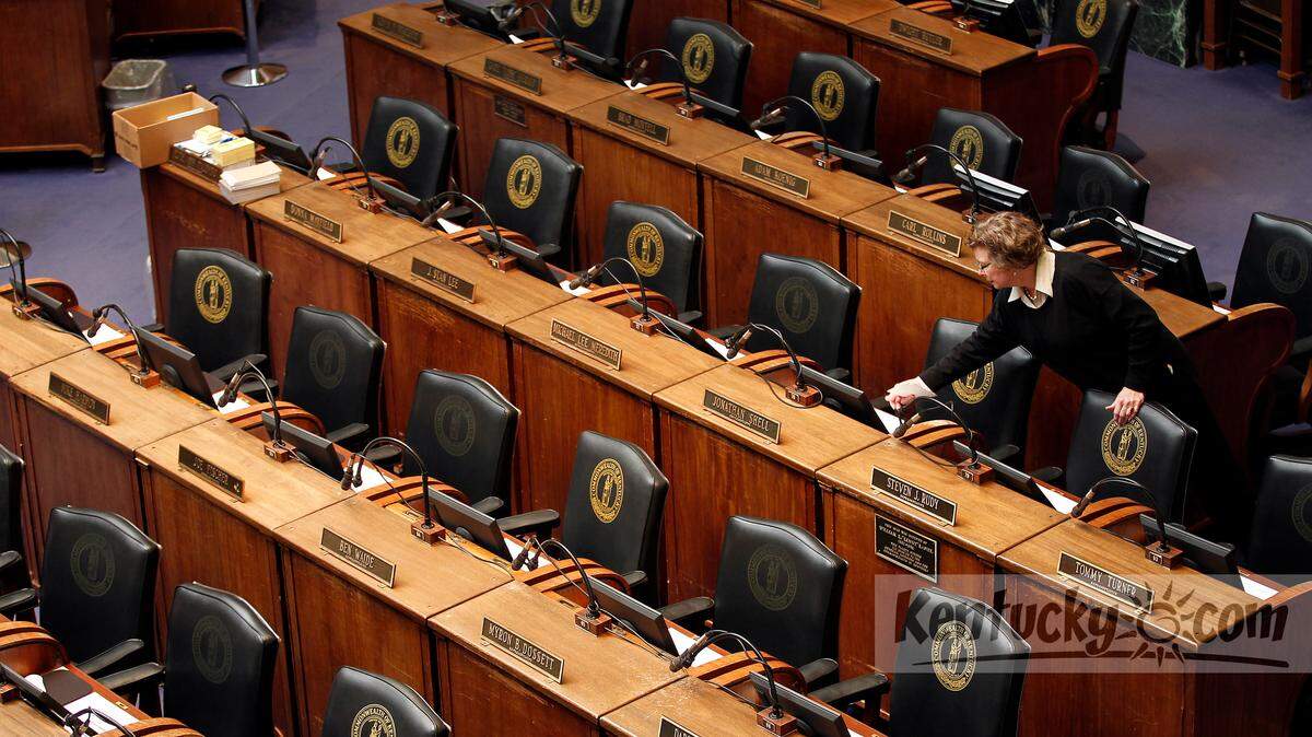 House Clerk Jean Burgin placed scripts out for the 13 new representatives in the House chambers in the State Capitol in Frankfort, Ky., Monday, January 7, 2013. The 2013 session of the General Assembly starts tomorrow. The scripts will assist the new representatives in how to deal with bills. Photo by Charles Bertram | Staff
