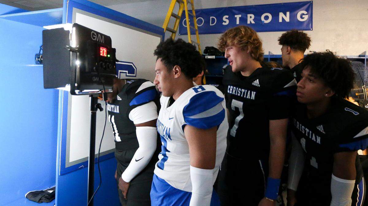 Quarterback Cutter Boley (7), center, joins his teammates in checking out the proceedings during Lexington Christian’s photo day last month. The Eagles kick off their season Aug. 19 against Bowling Green.