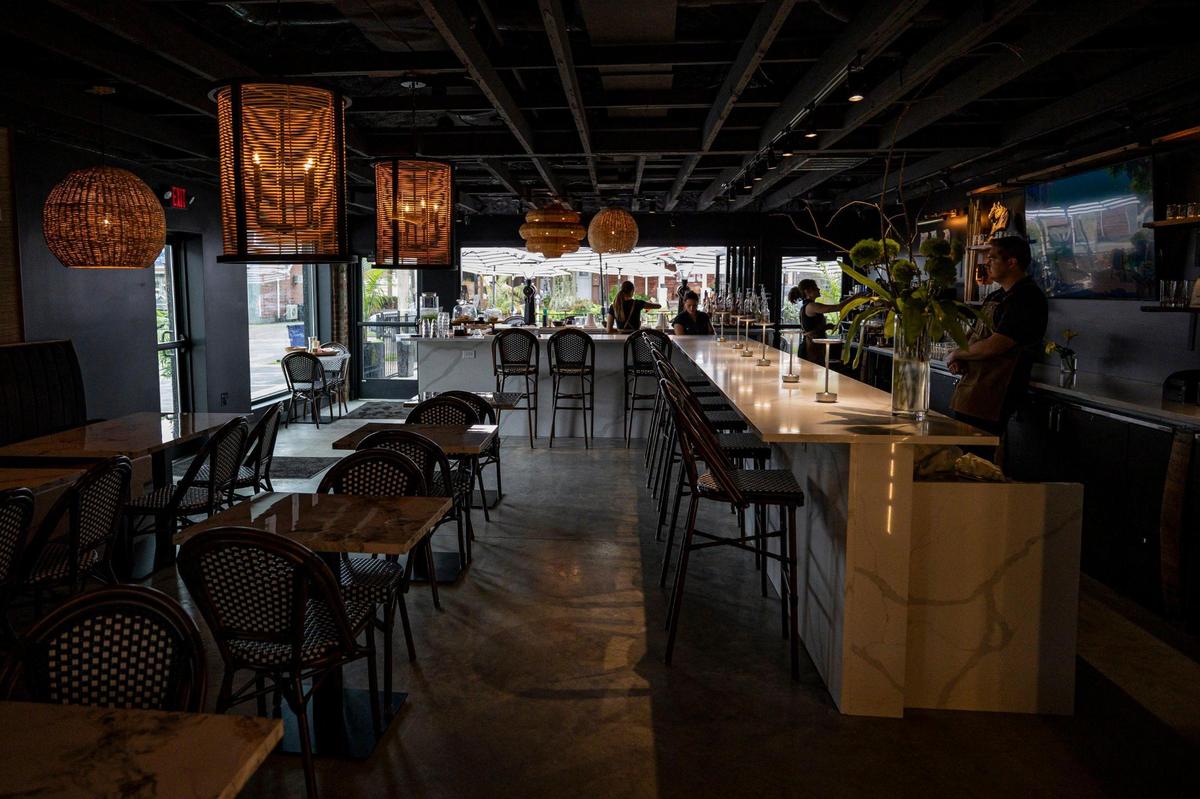 Rollie Mills, owner of Char, right, standing looking at the restaurant on Tuesday, July 1, 2025, on Ashland Avenue in Lexington, Ky.