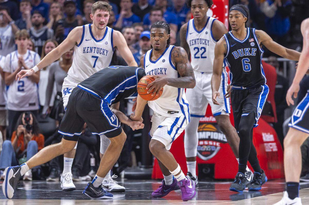 Kentucky guard Otega Oweh steals the ball from Duke guard Cooper Flagg during Tuesday’s game in the Champions Classic at State Farm Arena in Atlanta.