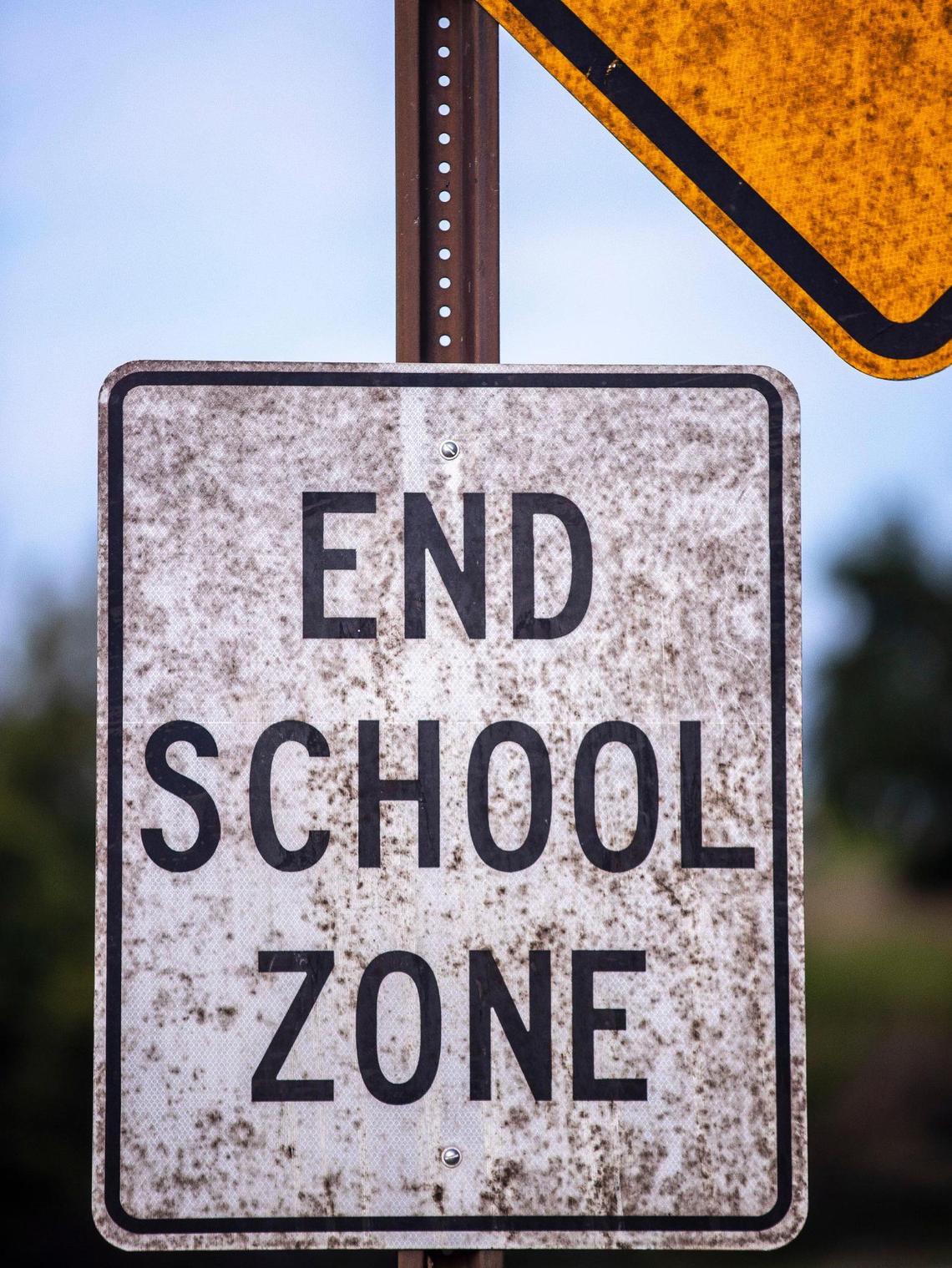 Whiskey fungus grows on a street sign near Peaks Mill Road in Franklin County, Ky., where residents are fighting more Buffalo Trace bourbon warehouses.