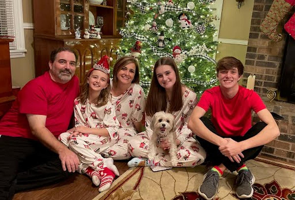 From left to right, Drew, Anne Michael, Ginny, Hope and Reed Hensley, with dog Hershey. The family’s home was one that was destroyed in the 2021 Western Kentucky tornadoes.