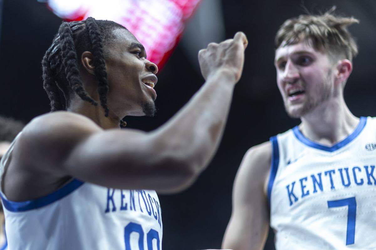 Kentucky’s Otega Oweh, left, and Andrew Carr react after Oweh scored a basket against Oklahoma during their SEC Tournament game at Bridgestone Arena in Nashville, Tennessee.