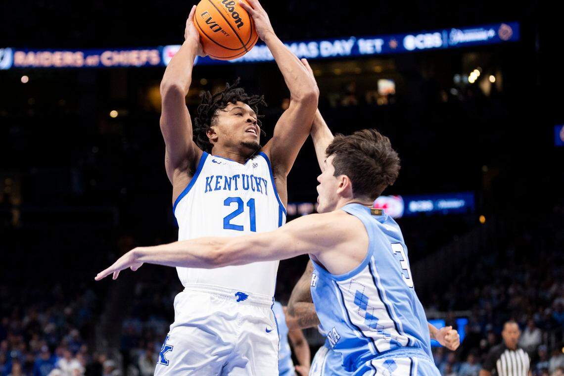 Kentucky’s D.J. Wagner (21) drives to the basket against North Carolina during the the CBS Sports Classic at State Farm Arena in Atlanta. Wagner finished with 14 points, six rebounds and five assists.