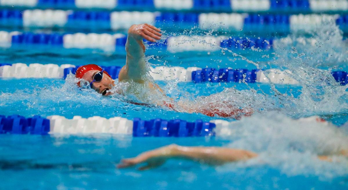 West Jessamine’s Lily DeLong swims in the championship heat of the 100-yard freestyle at the 2023 KHSAA state meet at the University of Kentucky’s Lancaster Aquatic Center on Friday. DeLong won with a time of 51.35.