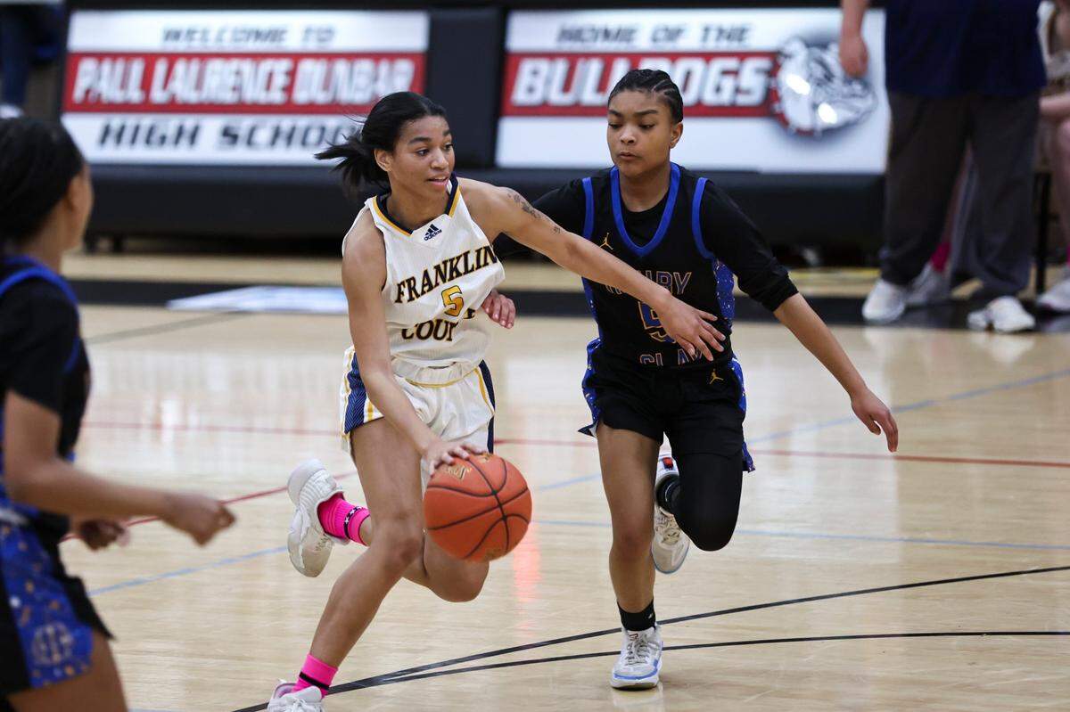 Franklin County’s Leia Hogan, left, dribbles against Henry Clay’s Brinley Dumphord during last season’s 11th Region Tournament semifinals on March 7.