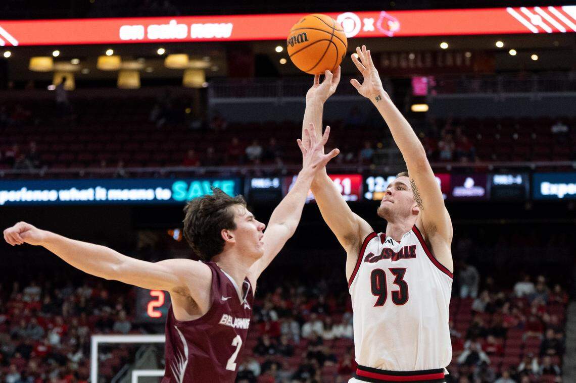Louisville Cardinals forward Noah Waterman (93) attempts a jump shot against Bellarmine Knights guard Tyler Doyle (2) during their game on Tuesday, Nov. 19, 2024 at the KFC Yum! Center in Louisville, Ky.