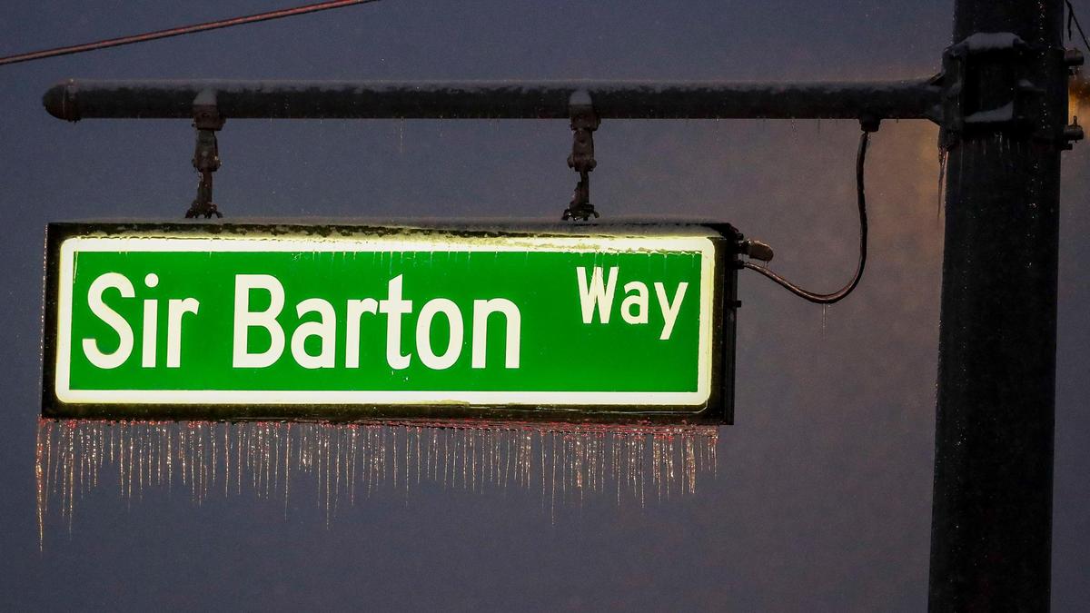Icicles hang from the Sir Barton Way street sign in the Hamburg area of Lexington on Friday, Jan. 10, 2025 in Lexington, Ky. Snowfall hit Lexington after a week of snow and ice.
