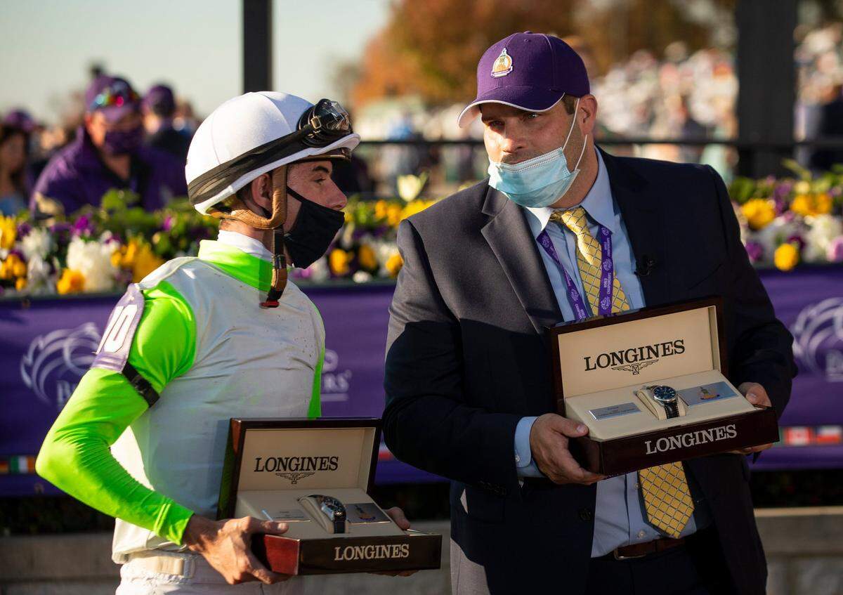 Horse trainer Brad Cox, right, a Louisville native, had a breakout season in 2021.