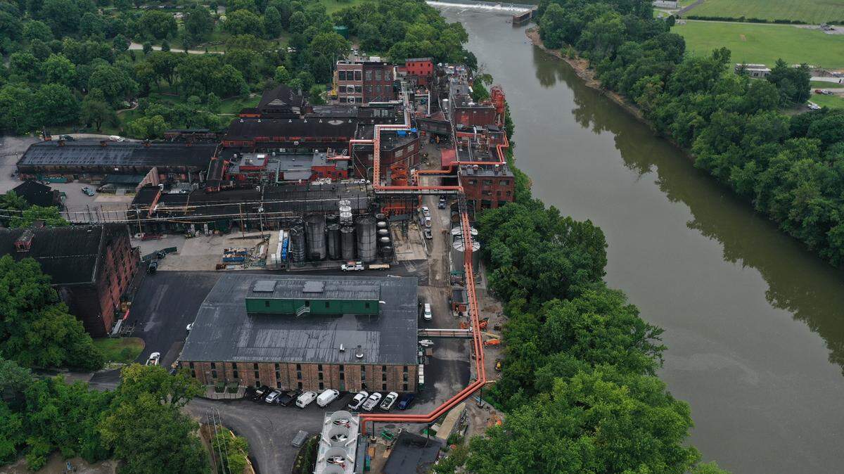 The mudslide occurred under the water pipes along the trees at the edge of the river, seen in this shot from before the flooding. Part of the pavement next to the Dry House, foreground, collapsed into the Kentucky River.