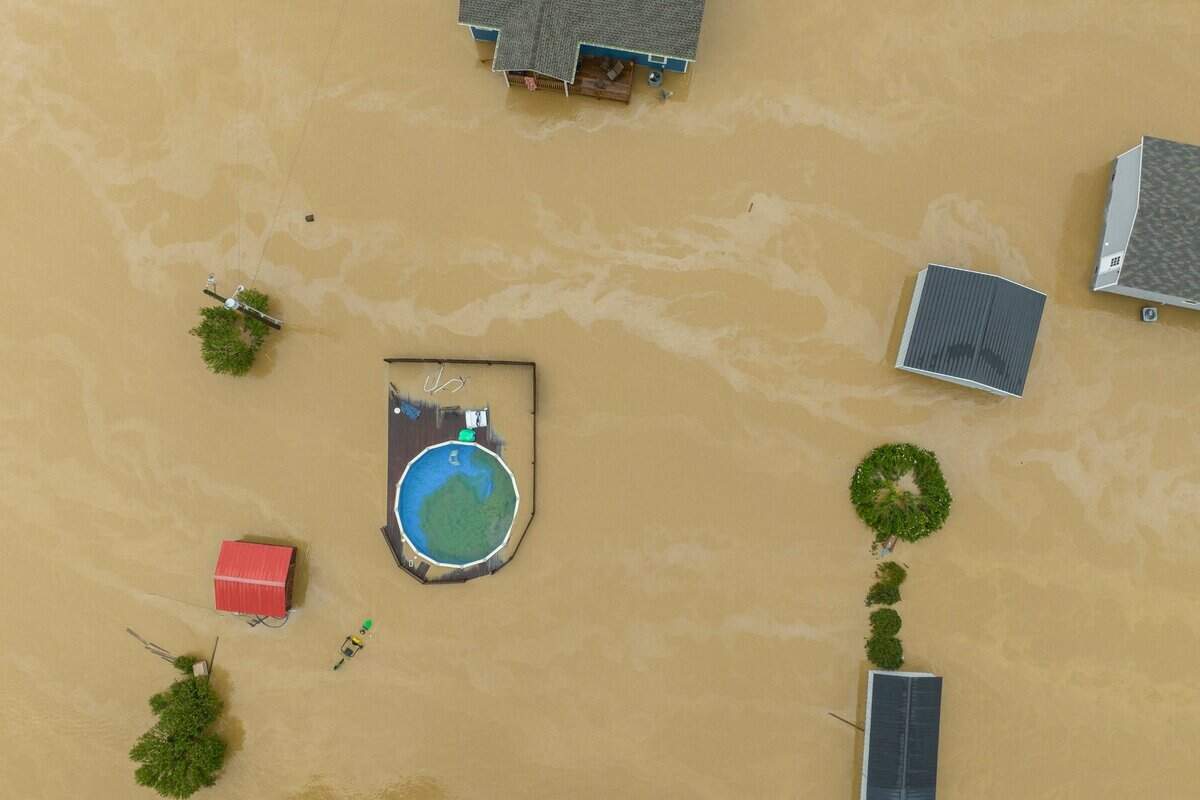 Home and structures are flooded near Quicksand, Ky., Thursday, July 28, 2022.