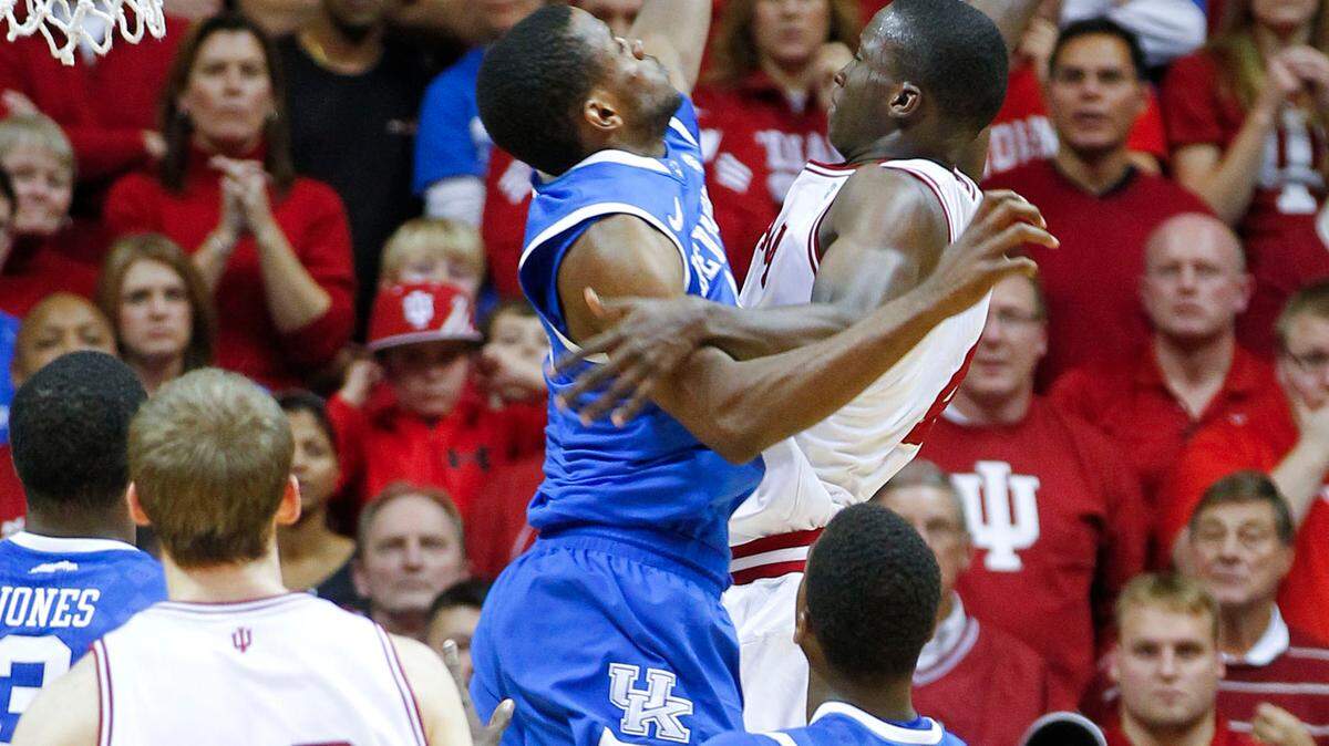 Indiana Hoosiers guard Victor Oladipo (4) dunked over Kentucky Wildcats guard Darius Miller (1) finishing with 13 points as Indiana beat #1 Kentucky 73-72 on Saturday December 10, 2011  in Bloomington, IN.  Photo by Mark Cornelison | Staff