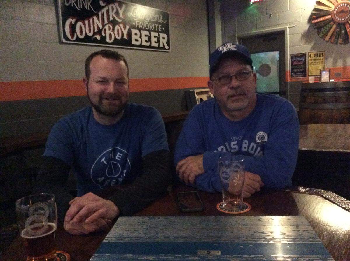 Brian Pulley, left, and Jon Morris are reselling sections of bleachers that were removed from the upper level of Rupp Arena last summer. They work under the name Big Blue Benches.