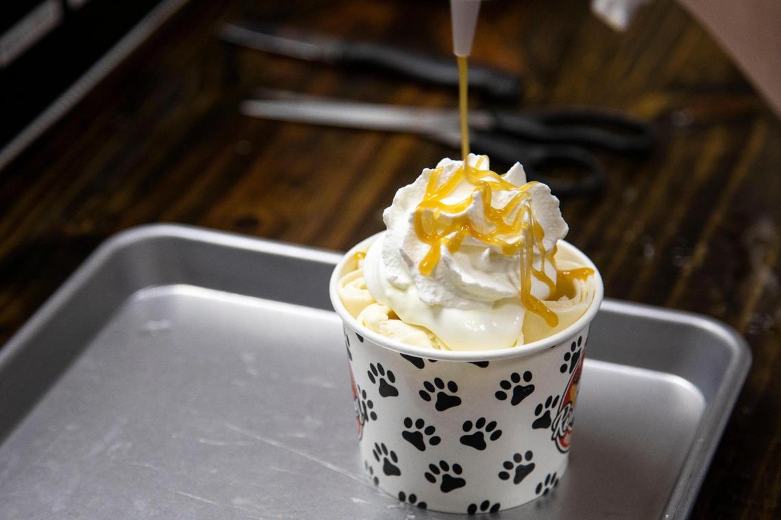 A serving of rolled ice cream is decorated at Roll Over Rolled Ice Cream June 17 The Morehead ice cream shop helps rescue dogs and is pet-friendly with dog treats.