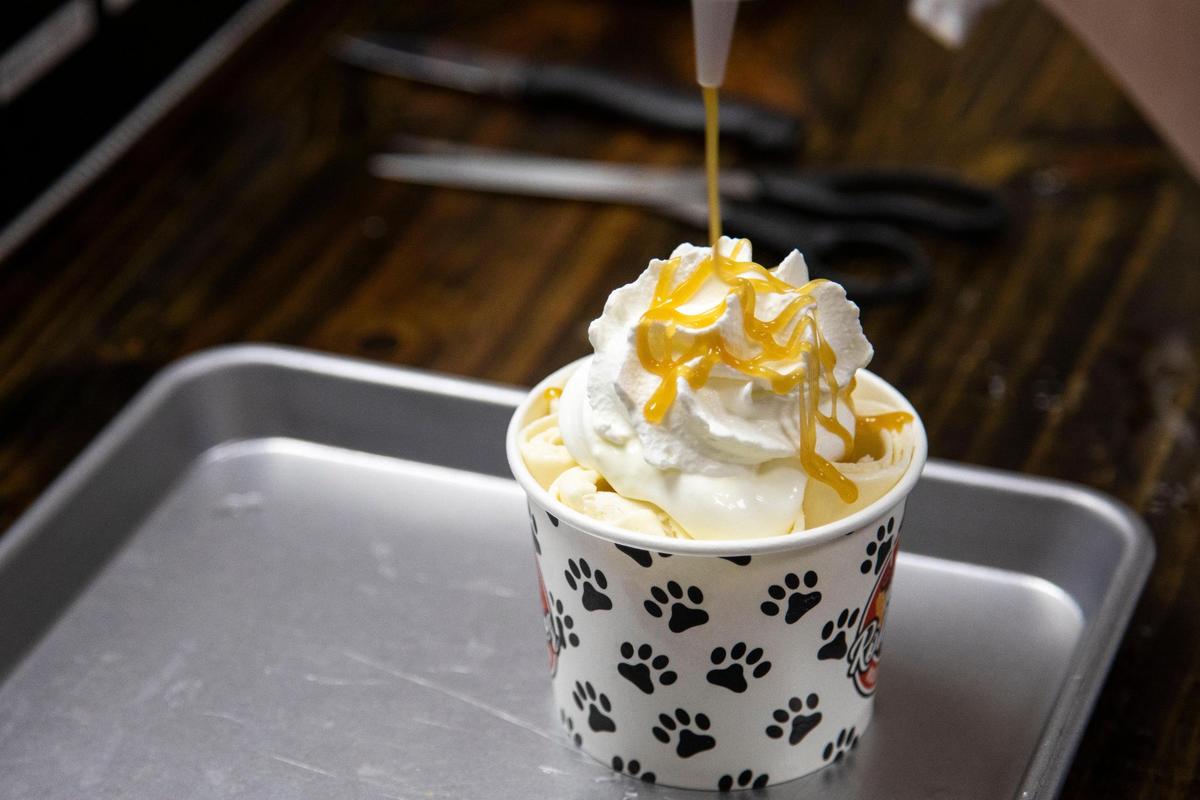 A serving of rolled ice cream is decorated at Roll Over Rolled Ice Cream June 17 The Morehead ice cream shop helps rescue dogs and is pet-friendly with dog treats.