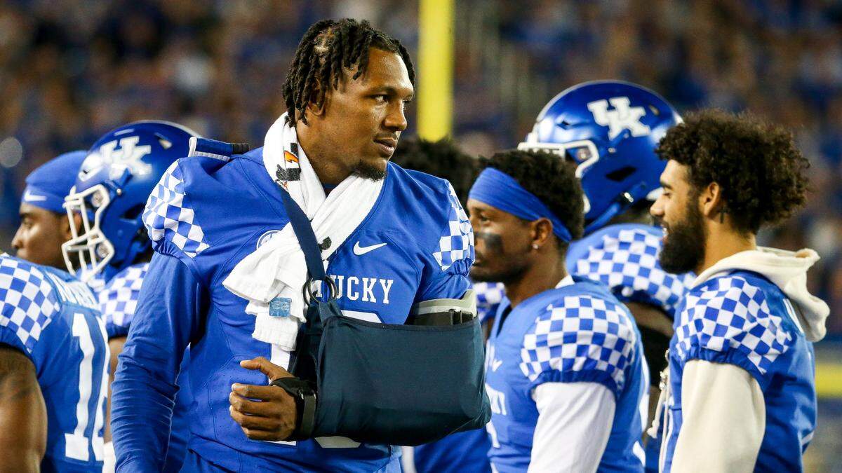 Injured Kentucky linebacker J.J. Weaver watched Saturday night’s game against Northern Illinois from the sideline.