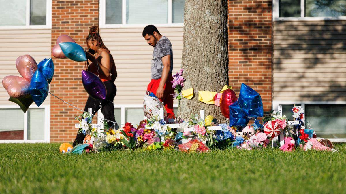 Members of the community and FaithPointe Church created a memorial during a vigil on Monday, May 9, 2022, at Parkway Plaza Apartments in Lexington, Kentucky, for Skyler Williams, 5, and Deon Williams, 13, who were killed last week. Their mother has been accused of killing the two children.