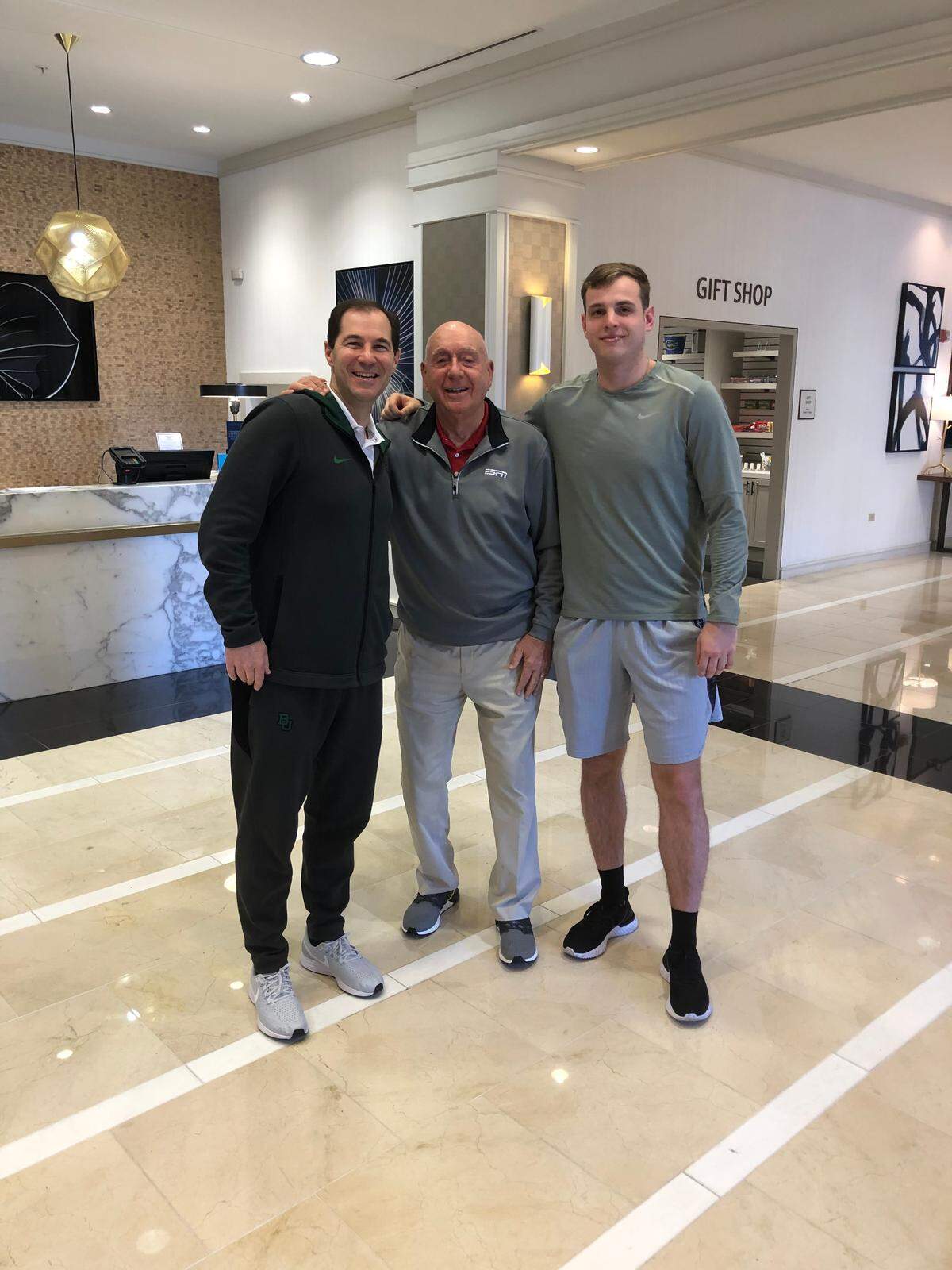 Baylor graduate assistant Peyton Prudhomme (right), a grandson of former LSU coach Dale Brown, posed for a photo with Scott Drew and Dick Vitale.
