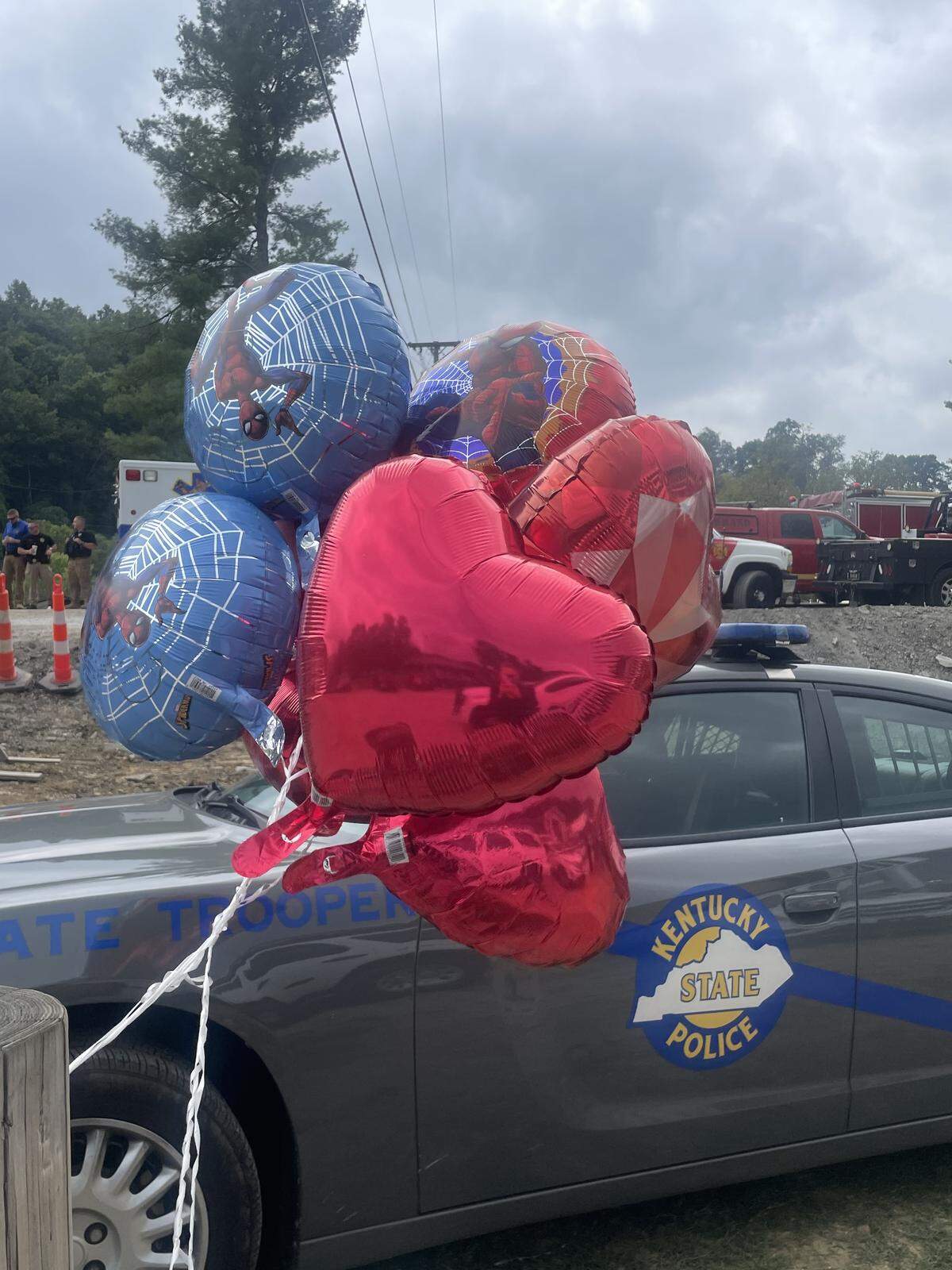 A Kentucky State Police cruiser sits outside the funeral services for Jayden Spicer, 10.
