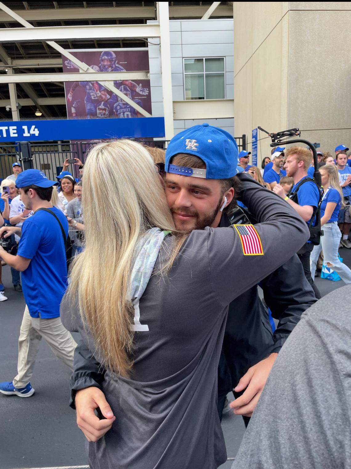Taylor Lanter greets her husband, Cole, on the Cat Walk ahead of a UK football game. Taylor played softball for Kentucky and Missouri. 