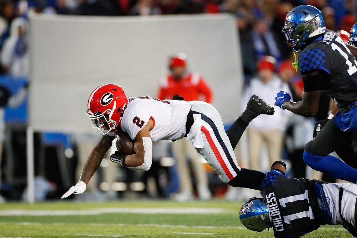 Georgia’s Kendall Milton carries the ball against Kentucky on Saturday, Nov. 19, 2022, at Kroger Field in Lexington, Kentucky.