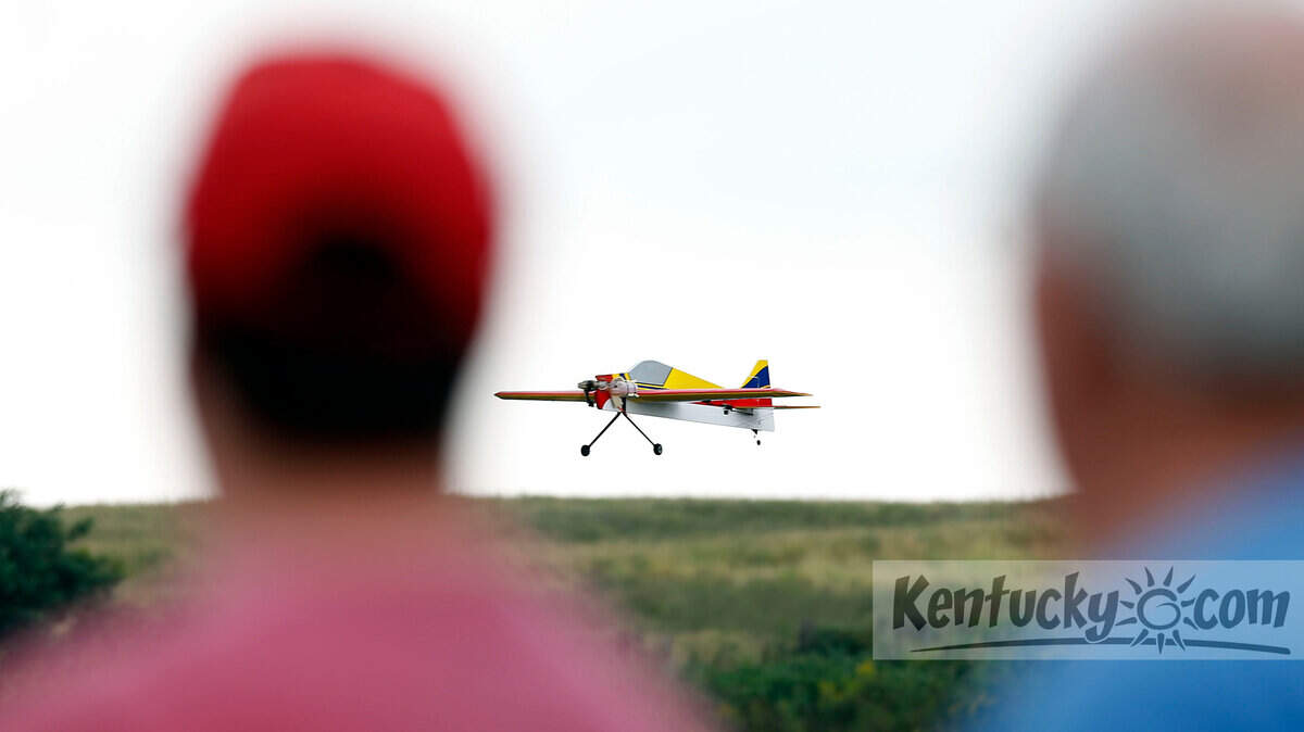 Dennis Brewster and his father, Joey Brewster, watched Dennis' Fusion plane in flight. 