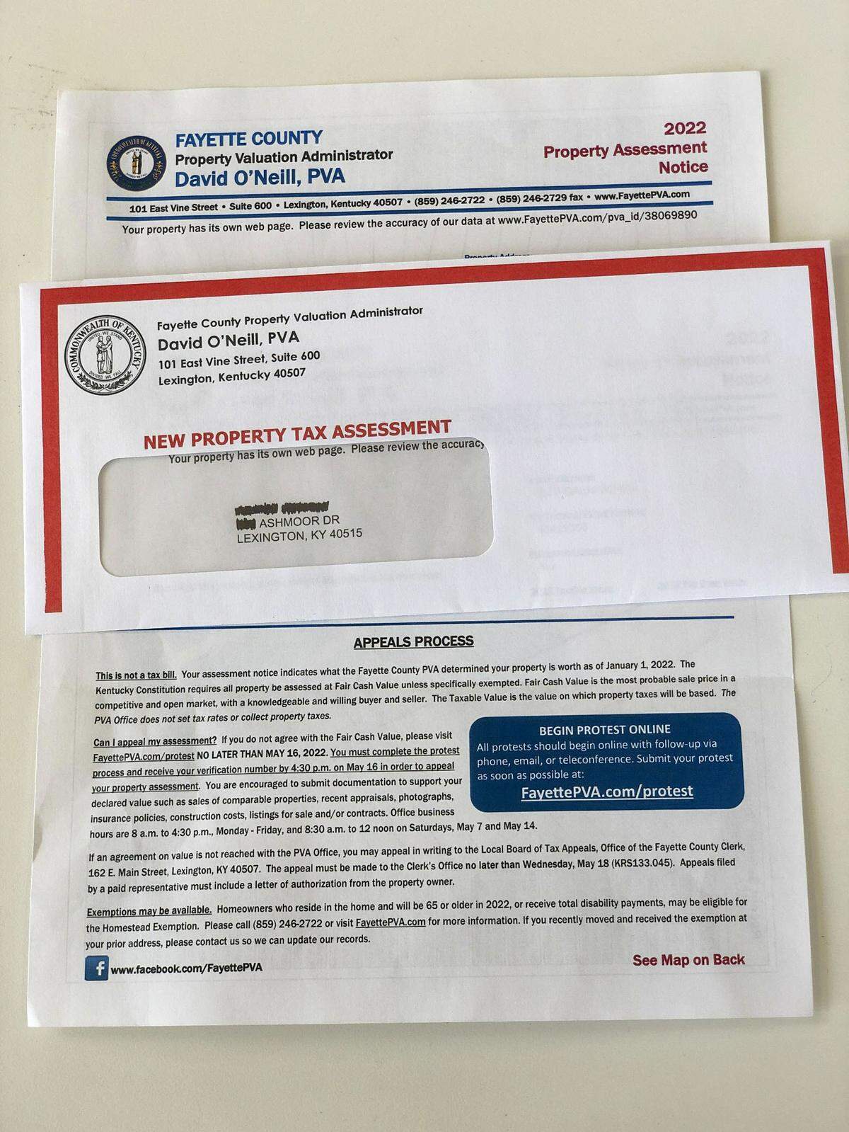 A sample property assessment form and the envelope it’s mailed within. 
