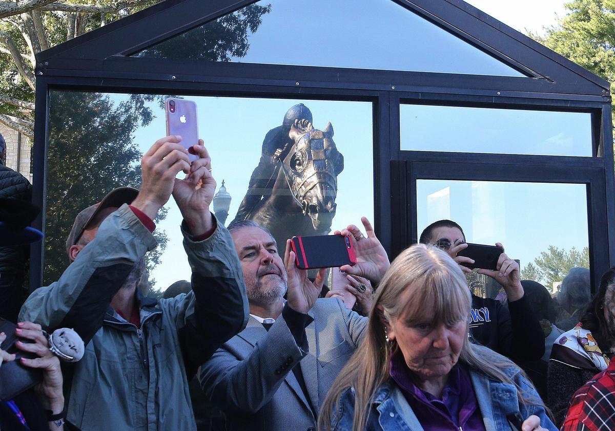 Spectators took photos after Jocelyn Russell’s statue of Secretariat was unveiled Saturday morning at Keeneland.