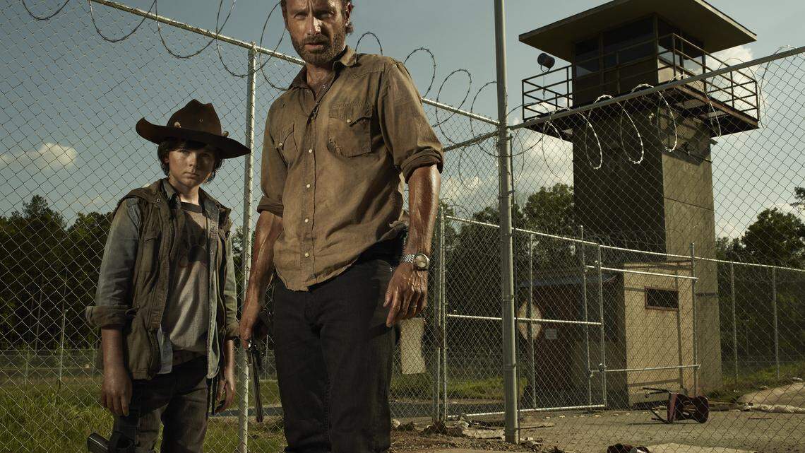 In The Walking Dead, Chandler Riggs, left, is Carl Grimes, the son of zombie fighter Rick Grimes, played by Andrew Lincoln. Chandler, 13, was in Lexington recently to appear at the annual ScareFest convention.  