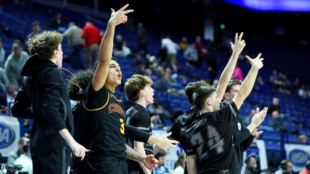 Cooper’s Jaidan Combs (3) celebrates during the final seconds in Rupp Arena on Thursday night. The Jaguars won their ninth game in a row and the 19th of their last 20.