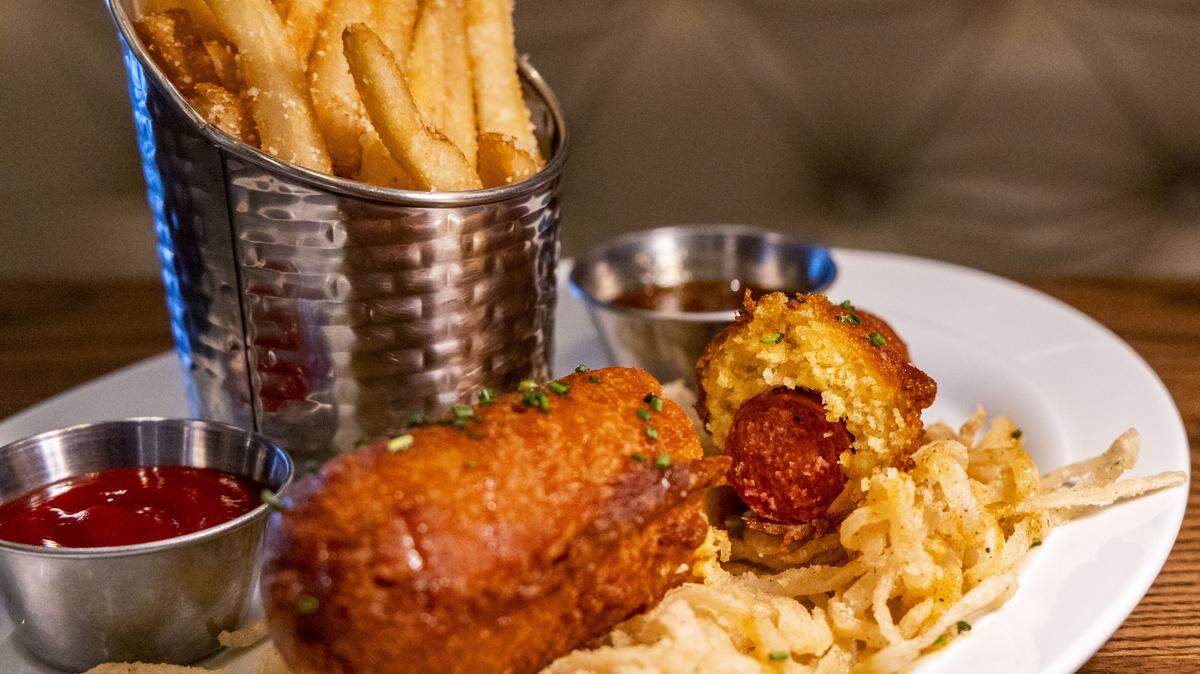 The Knife & Fork Corn Dog ($18) at Carson’s Back Porch features a crispy yet tender homemade batter. The dish, pared with a tangy carnival mustard, comes with a side of garlic Parmesan fries, but can be substituted for other sides for $2 (mashed potatoes, roasted rainbow carrots, mac n’ cheese, sweet Southern coleslaw, sautéed garlic mushrooms, loaded baked potato or asparagus with Béarnaise sauce). 
