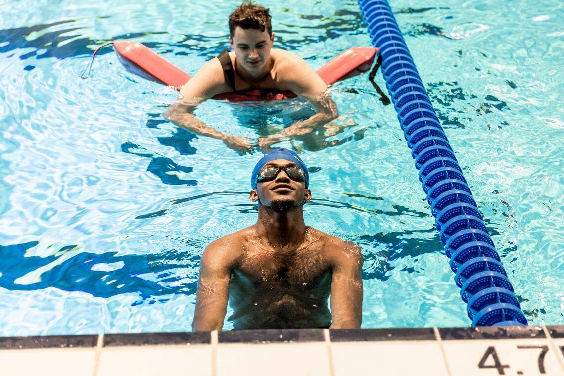 Kentucky basketball player Daimion Collins learns how to swim at the Lancaster Aquatic Center on UK’s campus.