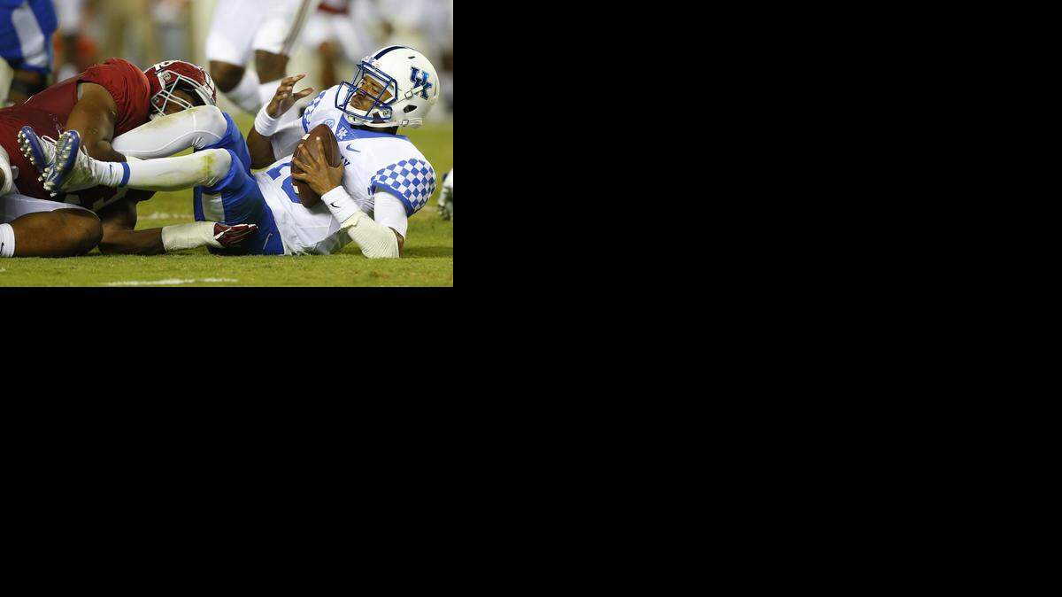 Kentucky quarterback Stephen Johnson (15) is sacked by Alabama defensive lineman Jonathan Allen, left, during the first half of an NCAA college football game, Saturday, Oct. 1, 2016, in Tuscaloosa, Ala. 