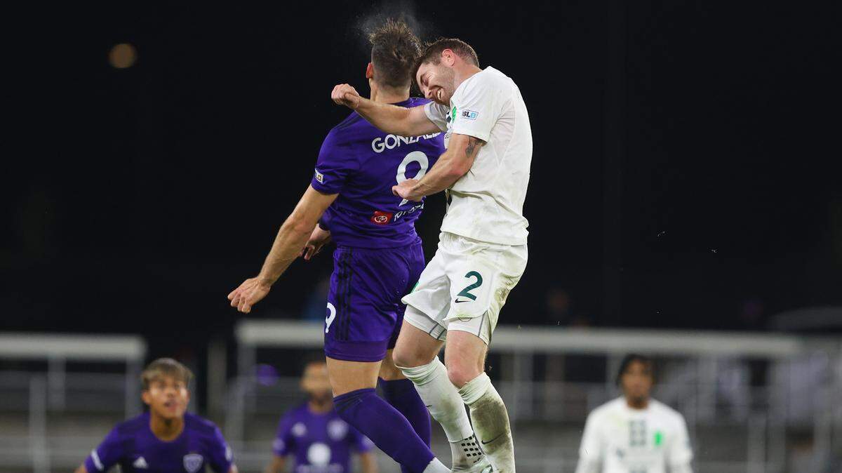 Lexington Sporting Club’s Tate Robertson (2) battled Louisville City’s Jorge Gonzalez during Wednesday night’s U.S. Open Cup match in Louisville.