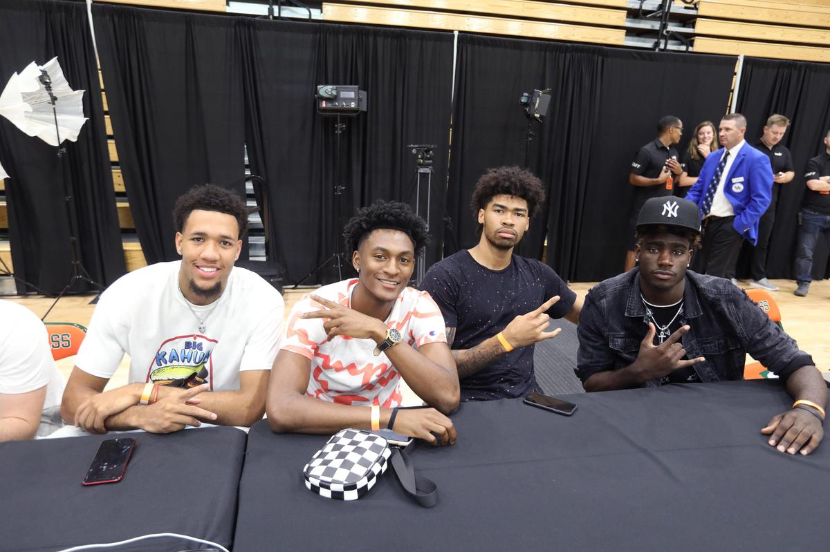 Kentucky basketball E. J. Montgomery, left, Immanuel Quickley, Kevin Richards and Kahlil Whitney watched the action Friday during The Basketball Tournament at Frederick Douglass High School. Photo by Matt Goins