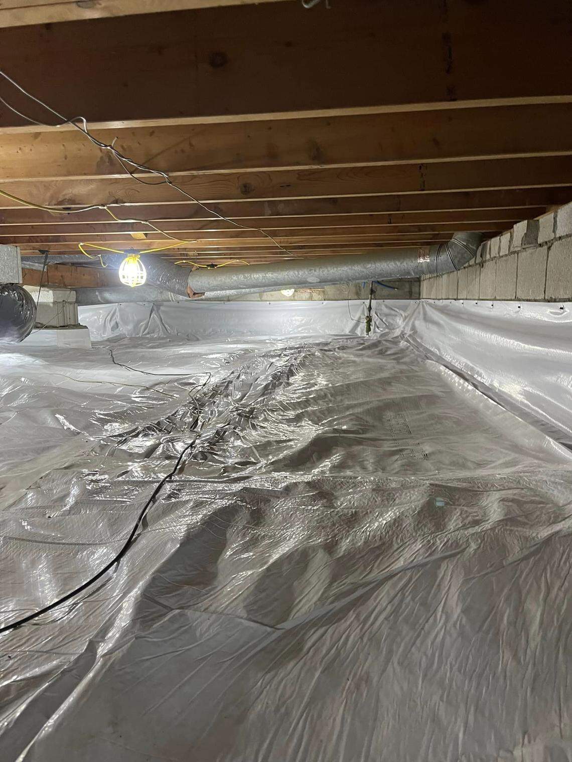 If a house with a crawlspace has an elevated level of radon, a system to reduce the risk would include lining the crawlspace with plastic.