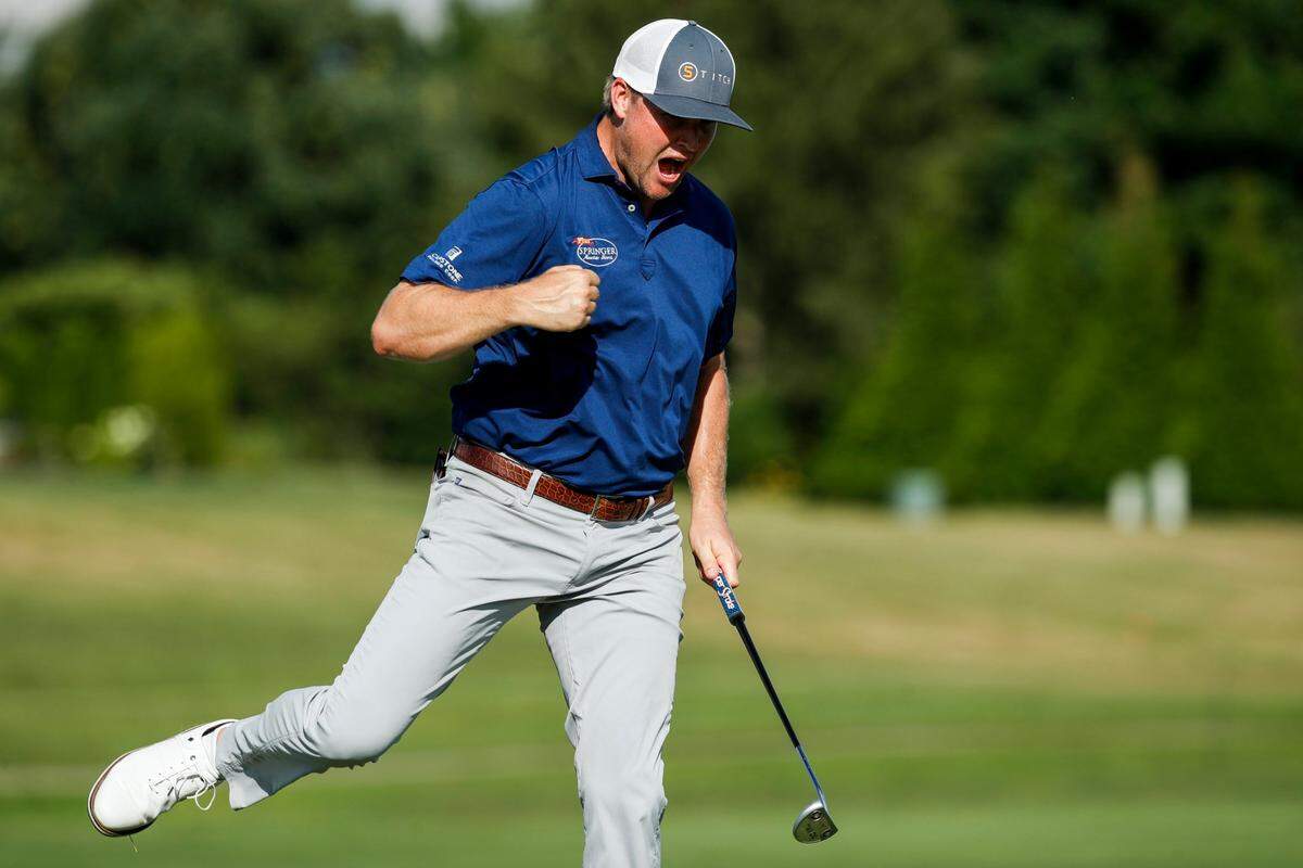 Trey Mullinax celebrates sinking a putt on hole 18 to win first place in the Barbasol Championship at Keene Trace Golf Club in Nicholasville, Ky., Sunday, July 10, 2022.