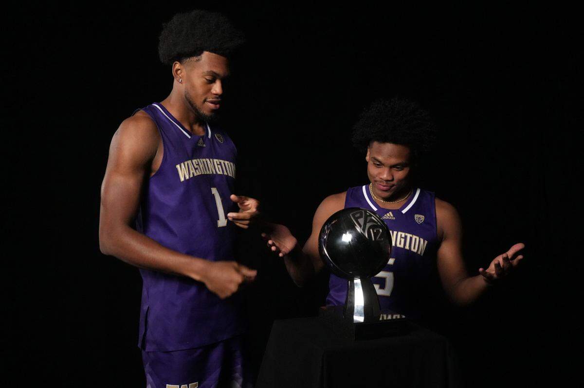 Oct 11, 2023; Las Vegas, NV, USA; Washington Huskies forward Keion Brooks Jr (1) and guard Sahvir Wheeler (5) pose during Pac-12 Media Day at Park MGM Las Vegas Conference Center. Mandatory Credit: Kirby Lee-USA TODAY Sports