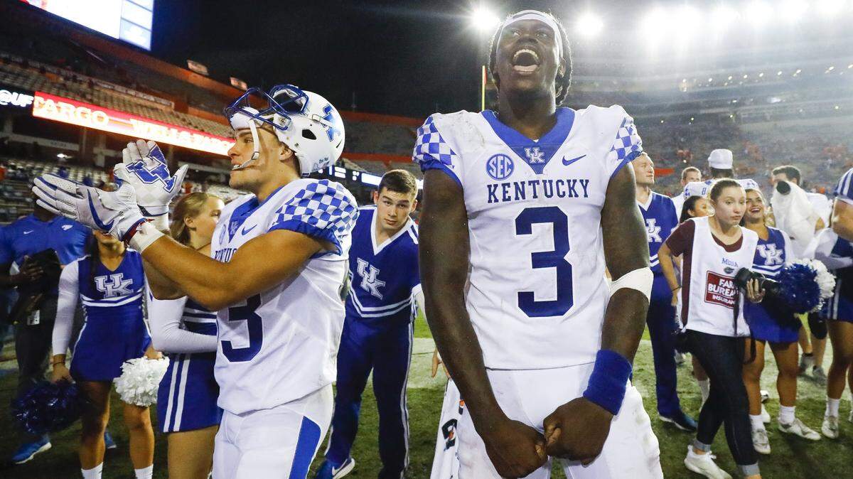 Kentucky quarterback Terry Wilson (3) celebrated after UK’s 27-16 upset of No. 25 Florida last week.