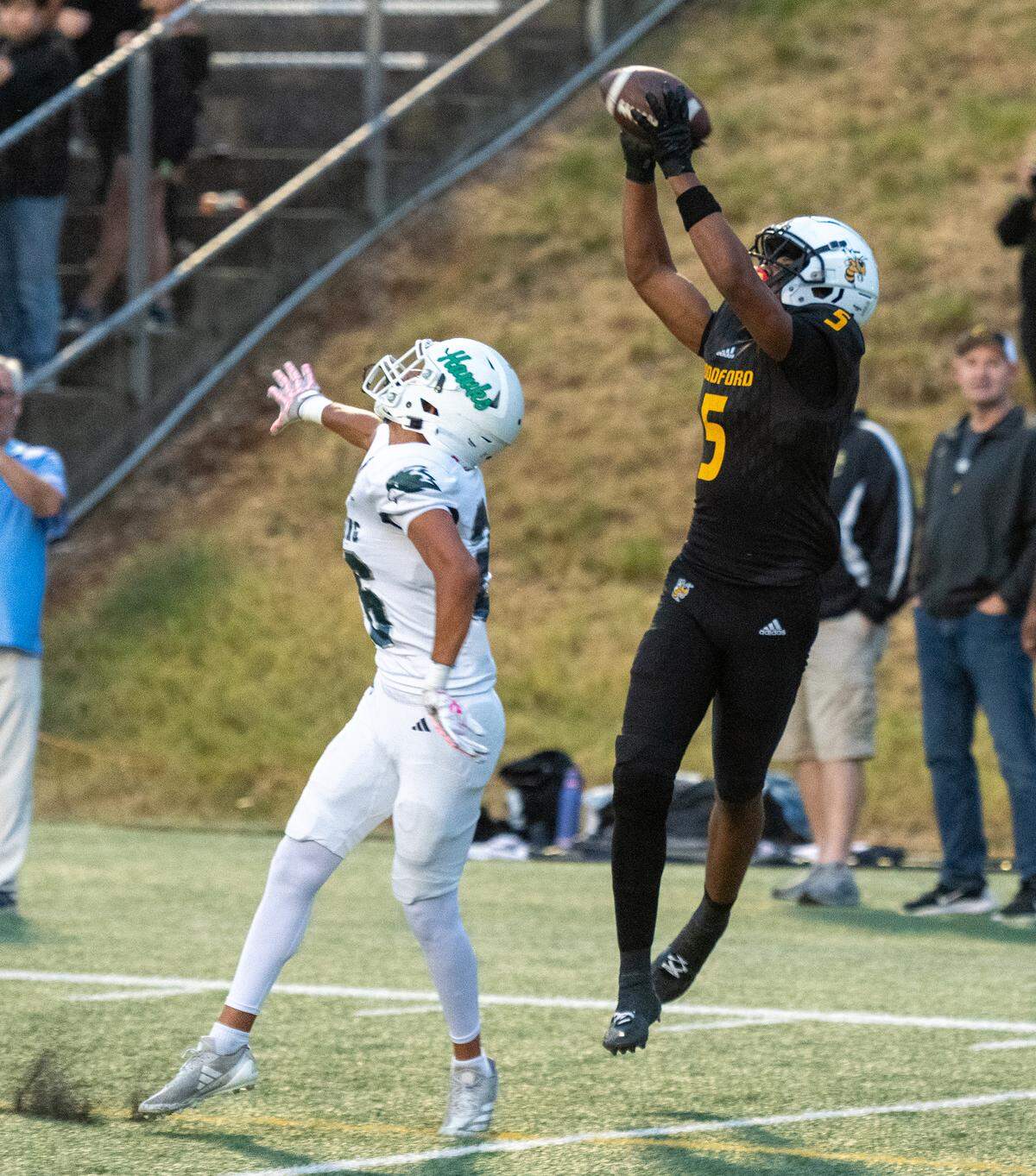 Woodford County's Omari Jointer (5) hauls in one of his two touchdowns during the first half of the Yellow Jackets’ 42-14 win against Great Crossing at Community Stadium in Versailles on Friday.