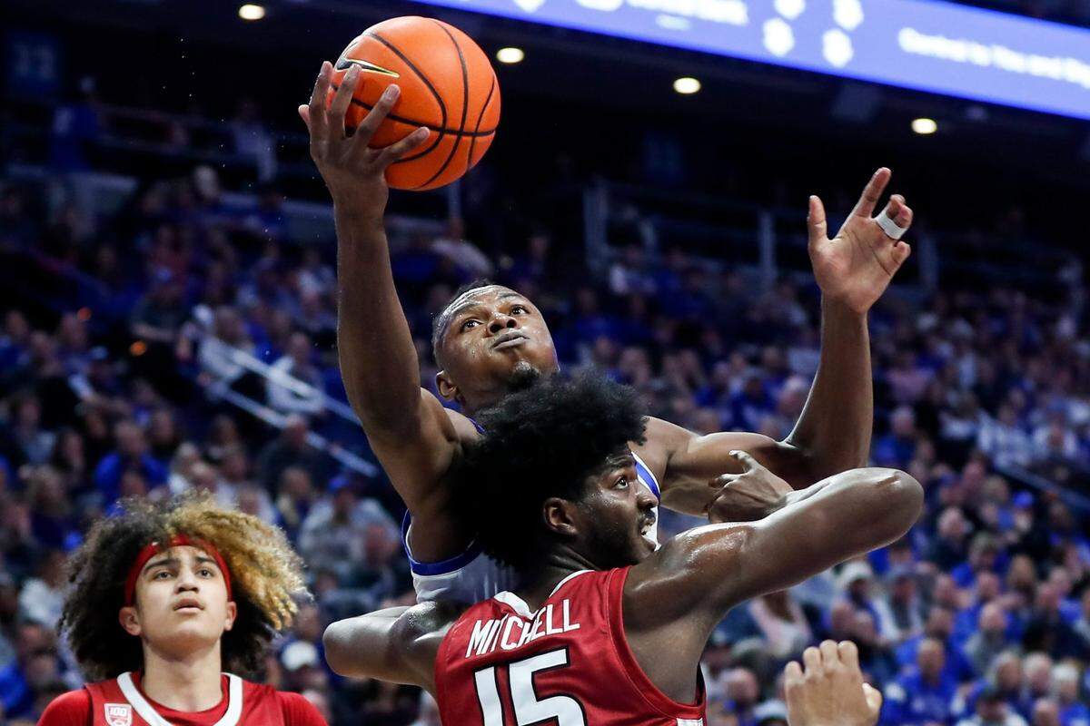 Kentucky Wildcats forward Oscar Tshiebwe (34) gets a rebound away from Arkansas Razorbacks forward Makhi Mitchell (15) during the game at Rupp Arena in Lexington, Ky., Tuesday, February 7, 2023.